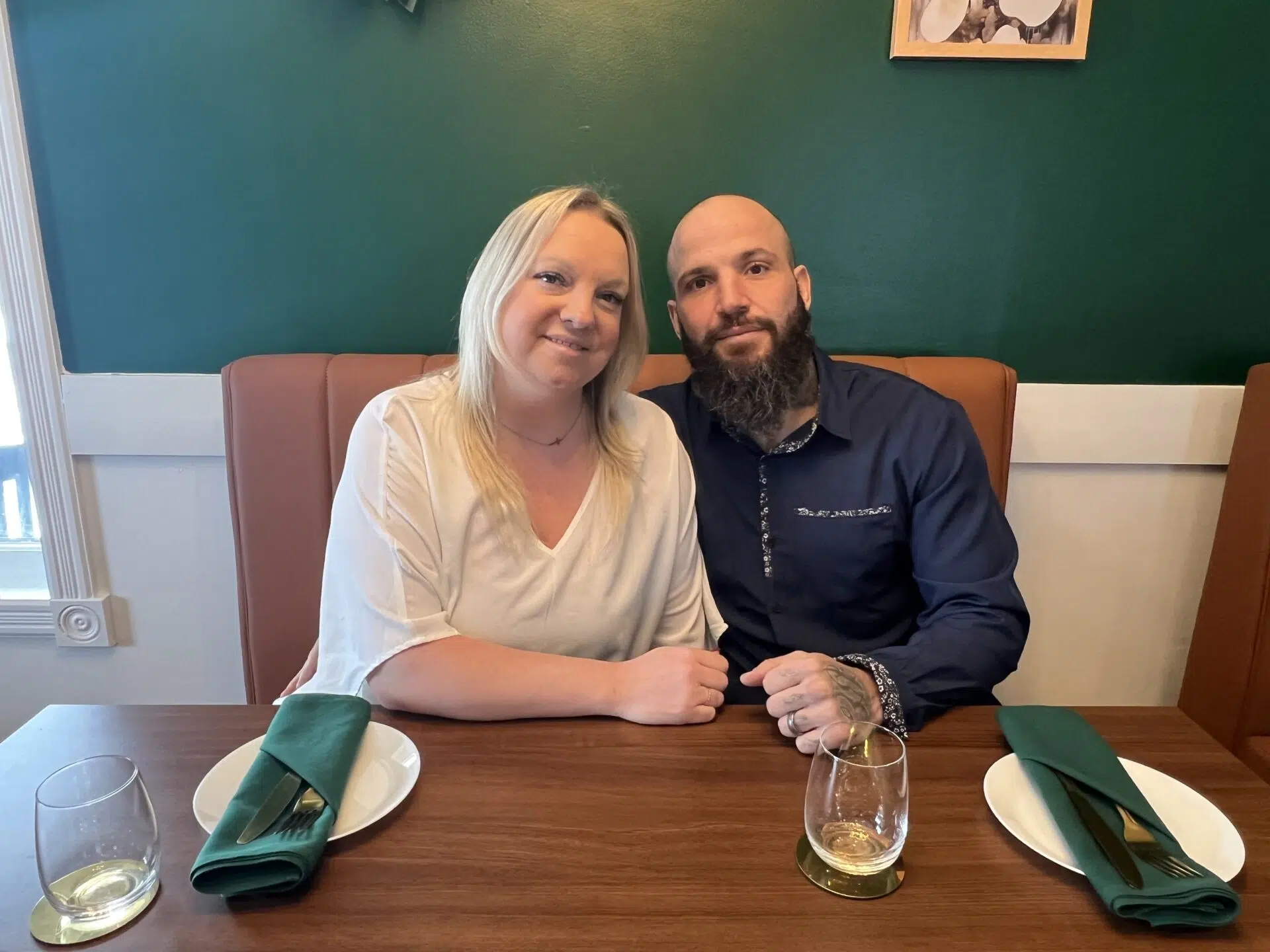 Melissa and Dan Savarie seated inside SoLo on Main