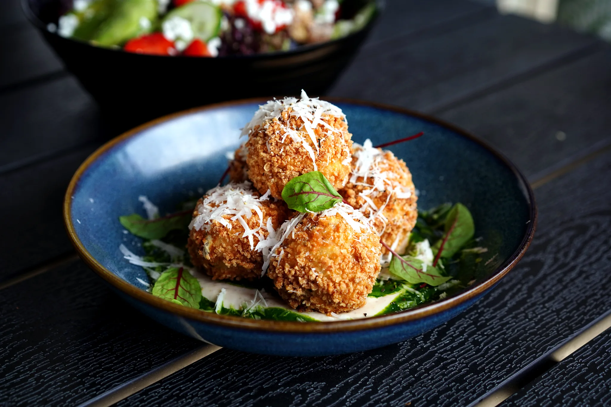 Caesar salad croquettes with pecorino and greens at SoLo on Main